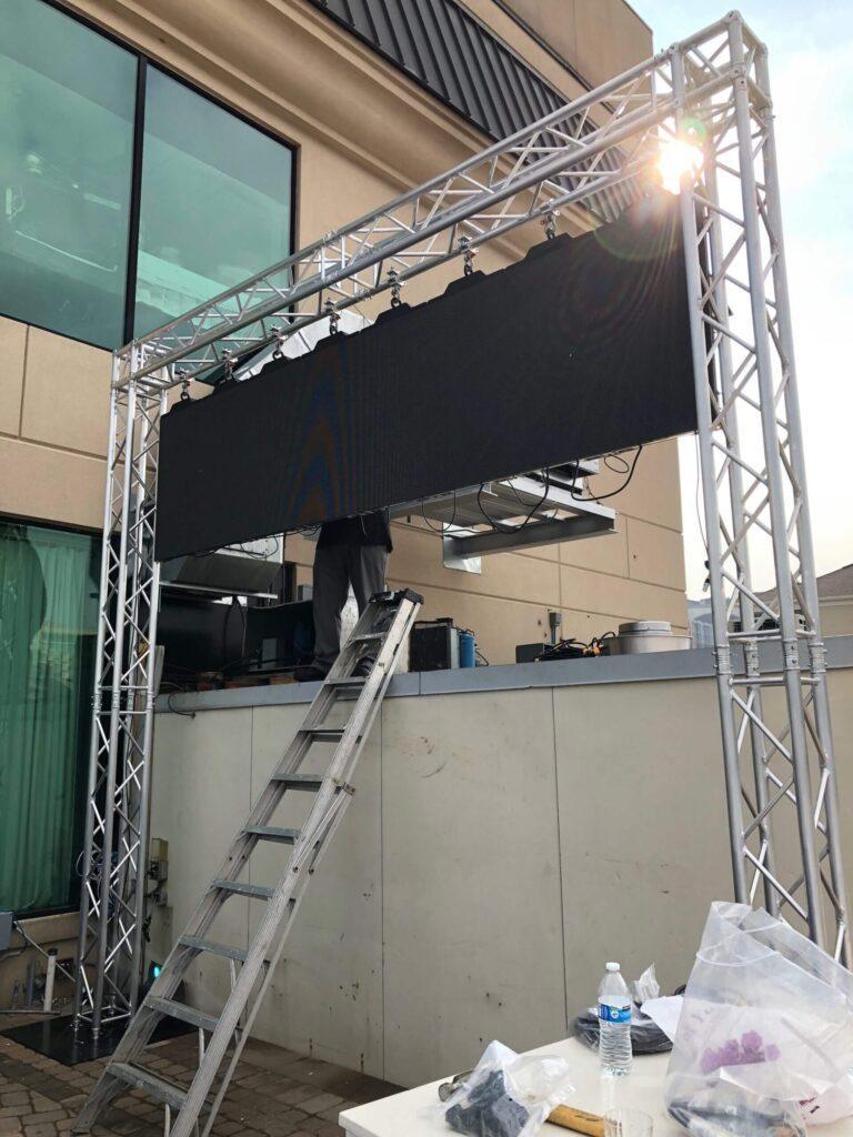 Now-we-hang-the-video-wall-scaled